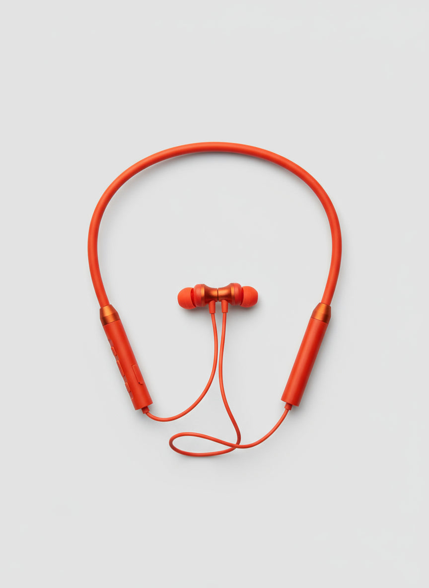 Orange wireless earbuds on a gray textured surface