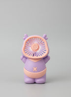 Purple and pink handheld fan with a bear design on a light gray background