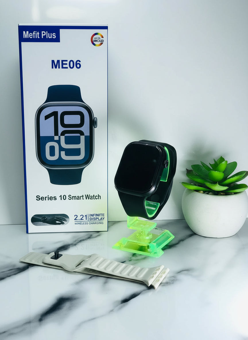 Smart watch with packaging, band, and wireless charger on a marble surface