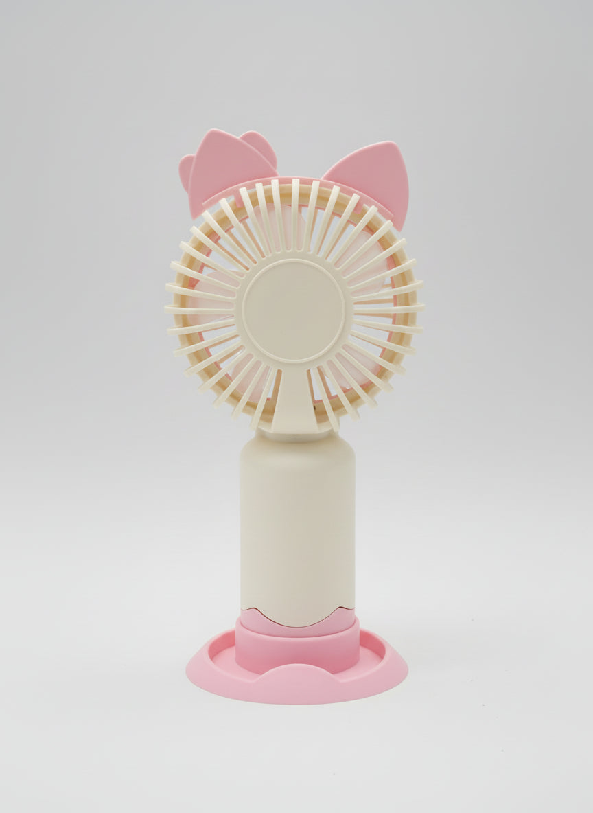 Pink handheld fan with cat ears on a light gray background