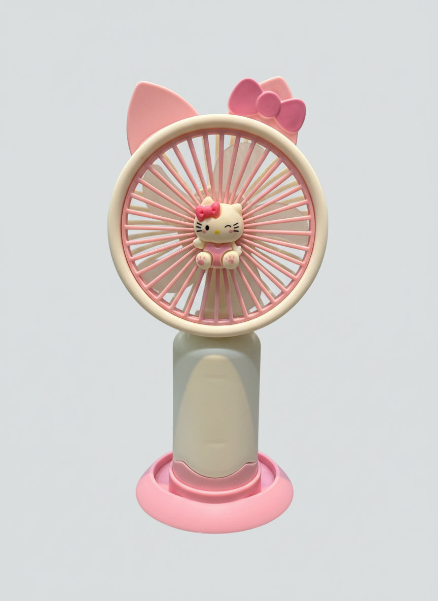 Pink and white handheld fan with Hello Kitty design on a light gray background
